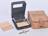 a suitcase and a pair of scissors next to it