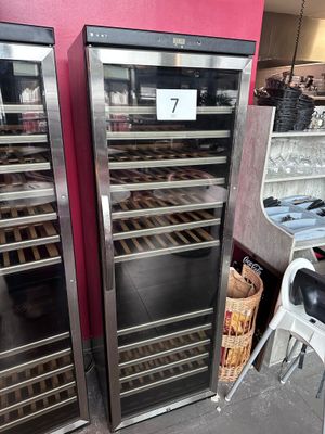 two refrigerators that are next to each other in a store