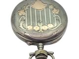 a silver pocket watch with a metal ring on it