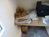 a microwave sitting on a shelf in the corner of a room