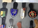 many different types of badges on display on a table