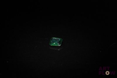 an image of a piece of emerald in the dark