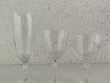 three empty wine glasses sitting on a table