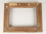 an old picture frame with a hole in the middle of it