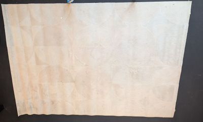 a piece of paper hanging from a clothes line on a clothes line