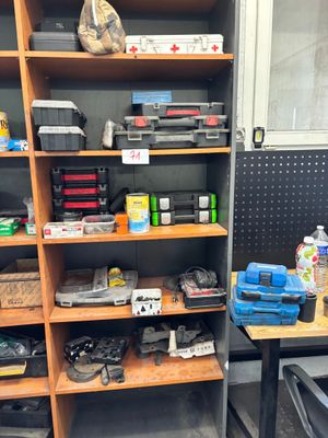 a room with a lot of tools on the shelves