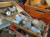 a box full of assorted items in a junkyard