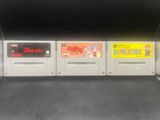 quatre cartouches de jeux Nintendo alignées les unes à côté des autres