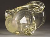 a glass vase with a glass ball inside of it