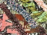 a close up of a quilt with a bunch of flowers on it