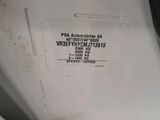 a label on the back of a white refrigerator