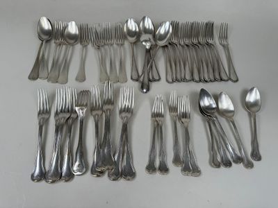 a lot of spoons and forks laid out on the table