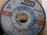 two grinding wheels in a box on a table