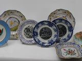 a lot of plates that are sitting on a table