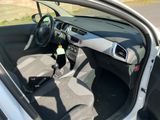 a small car with the door open and the driver ' s seat down