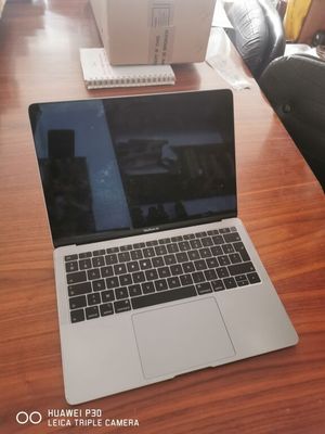 a laptop that is sitting on a table in front of a camera