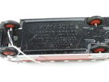 a black and red toy car on a white surface