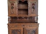 an image of a wooden cabinet with carvings on it
