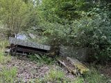 a bench sitting in the middle of a wooded area