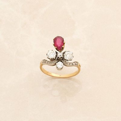 an image of a diamond and ruby ring on a white background