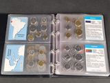 a binder with a lot of coins inside of it