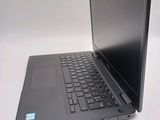a laptop computer sitting on a table with a white background