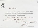 a handwritten letter written in french on a piece of paper