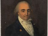 portrait d'un homme vêtu d'un manteau bleu et d'une chemise blanche