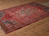 a rug on the floor in the middle of the room