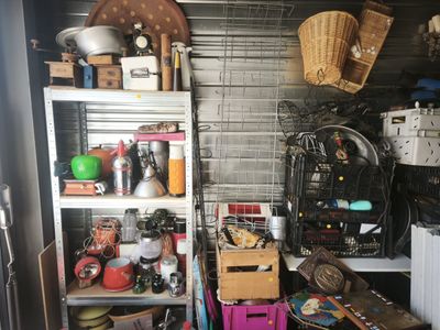 a room with a lot of stuff on the shelves