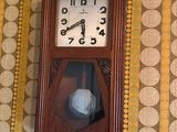 a clock hanging on the wall of a room