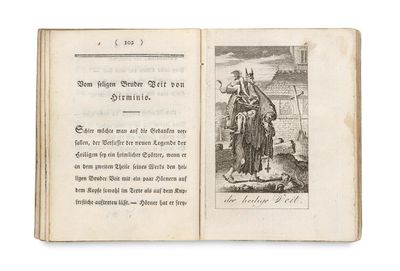un livre ouvert avec l'image d'un homme et d'un chien