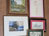 many pictures hanging on the wall of a room
