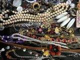 a pile of jewelry that is on a table