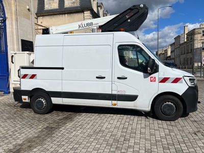 a white van that is parked in front of a building