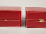pair of red leather jewelry boxes with gold hardware