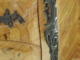 an image of a wooden chest of drawers with a marble top