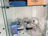 a glass display case with various electronics on it