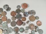 a lot of coins that are on the table