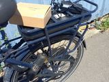 a bike that has a box on the back of it