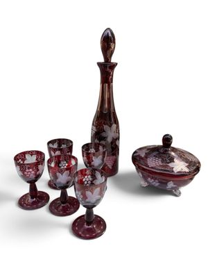 an image of a group of wine glasses and a decanter on a white background