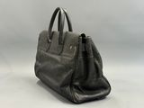 a black leather handbag on a white background
