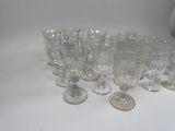 a lot of empty wine glasses sitting on a table