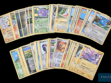 a lot of pokemon cards that are on the table