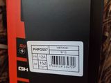 the back of a box with a barcode on it sitting on a bed