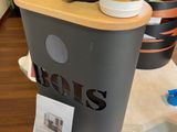 a cup of coffee on top of a coffee maker
