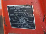 a close up of a sign on a red machine