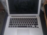 a laptop computer that is sitting on a table