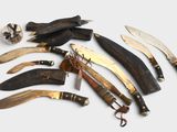 many different types of knives and knives on the table