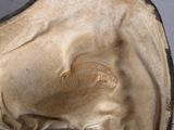 a close up of a hat with a logo on it